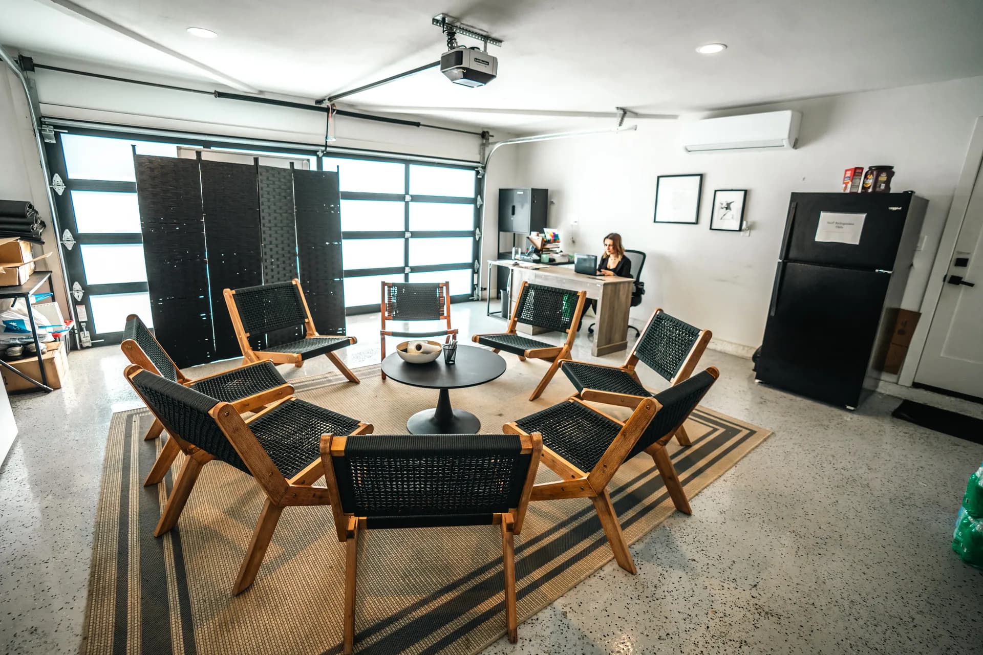 Meeting space with chairs and a desk